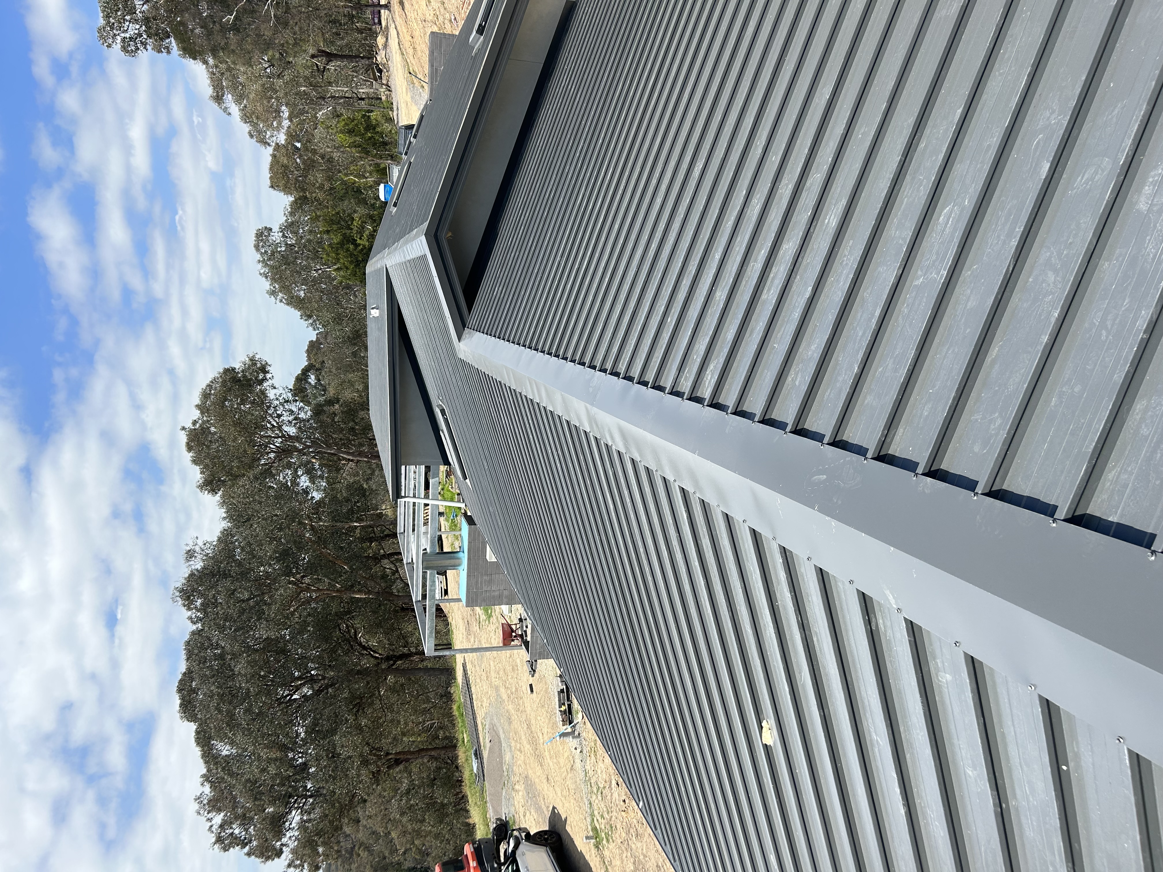 Dark Colorbond metal roof installation Victoria